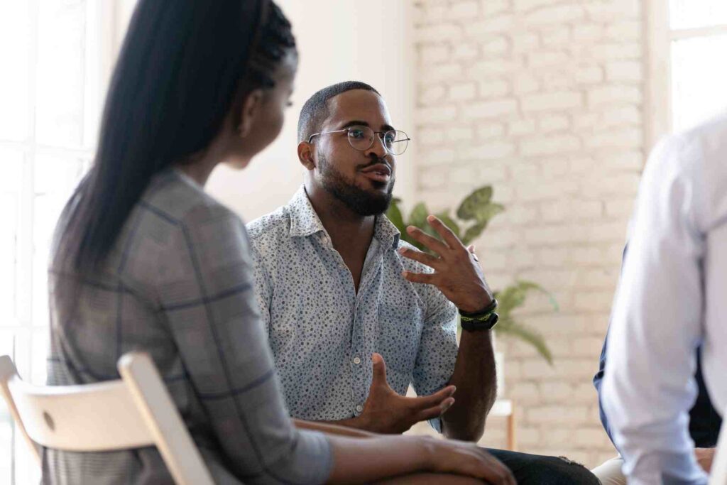 Man speaking during an intensive outpatient mental health therapy session