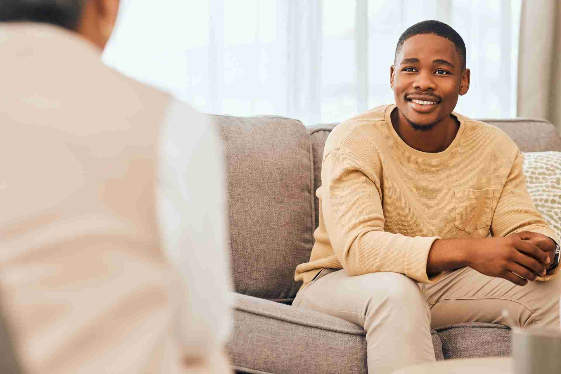 Man speaking with a mental health therapist during a counseling session