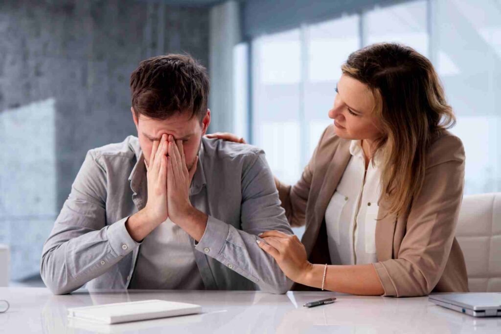 Professional offering emotional support to a person experiencing burnout and mental exhaustion.